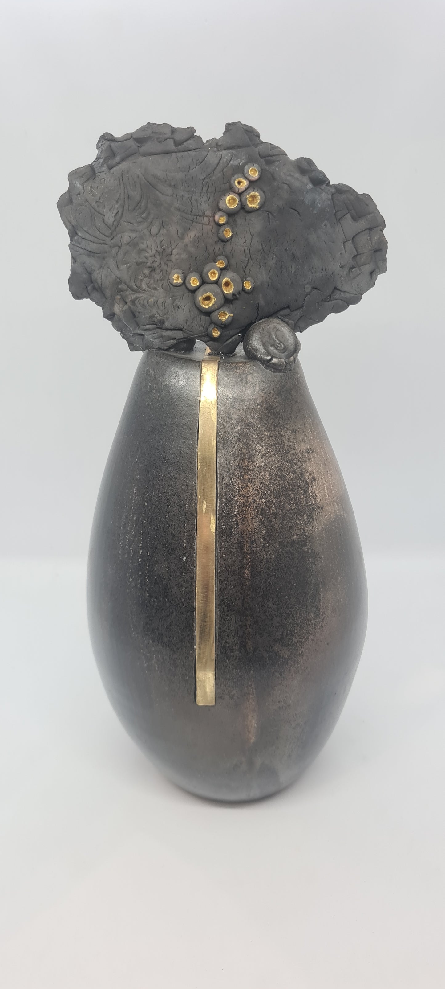 Black tall totem with strip brass inlay