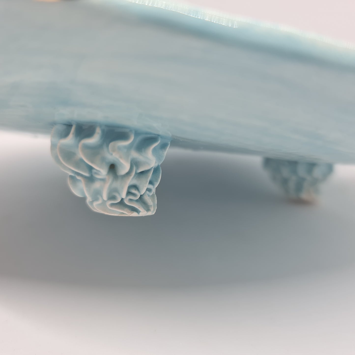 Raised Plate with Blue Piped Legs