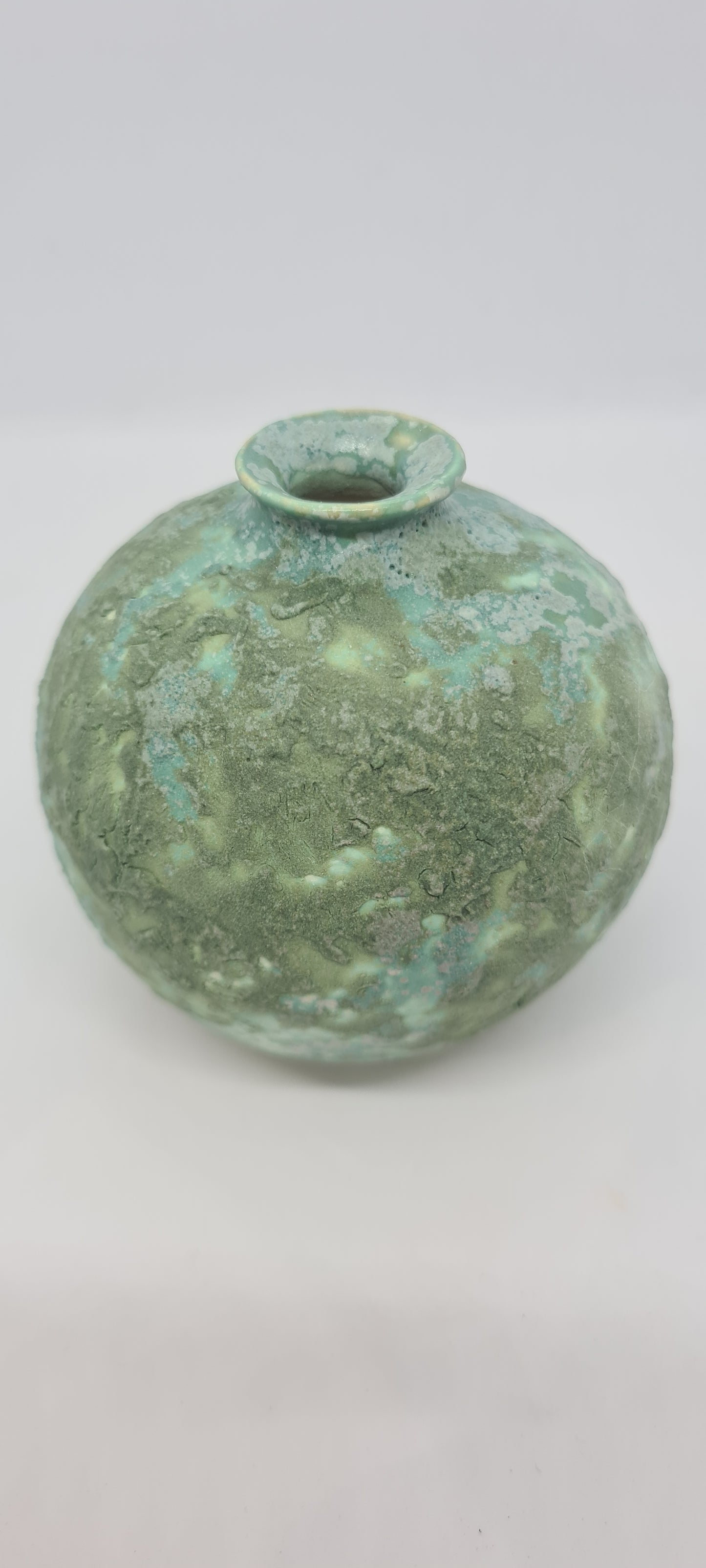Small rough green glazed vases