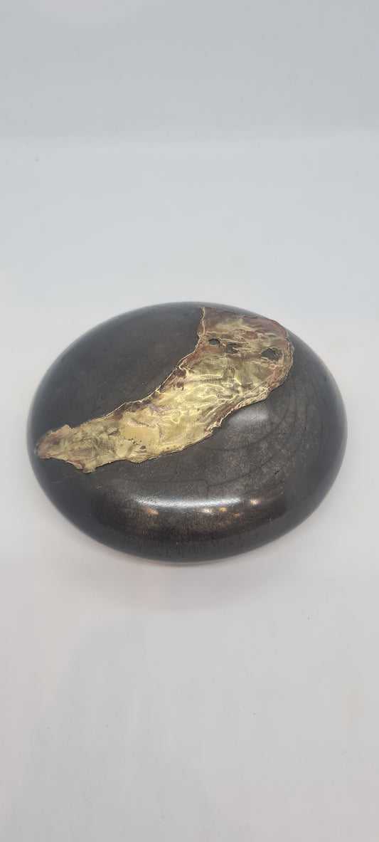 Black small spheres with brass inlay