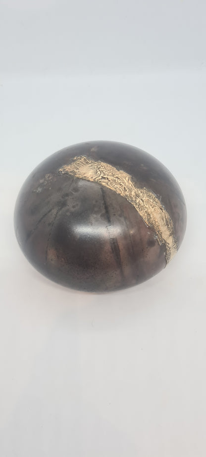 Black small spheres with brass inlay