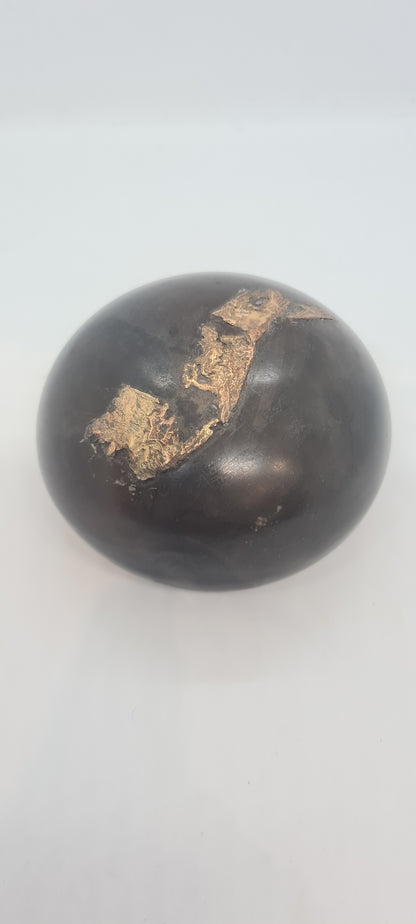 Black small spheres with brass inlay