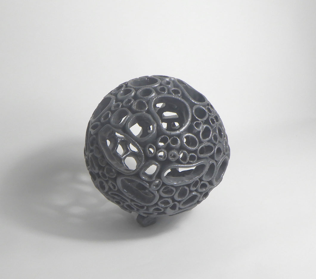 Sphere 2 - Black - Like the shoreline, this piece is both strong and vulnerable - shaped endlessly by tide and time.