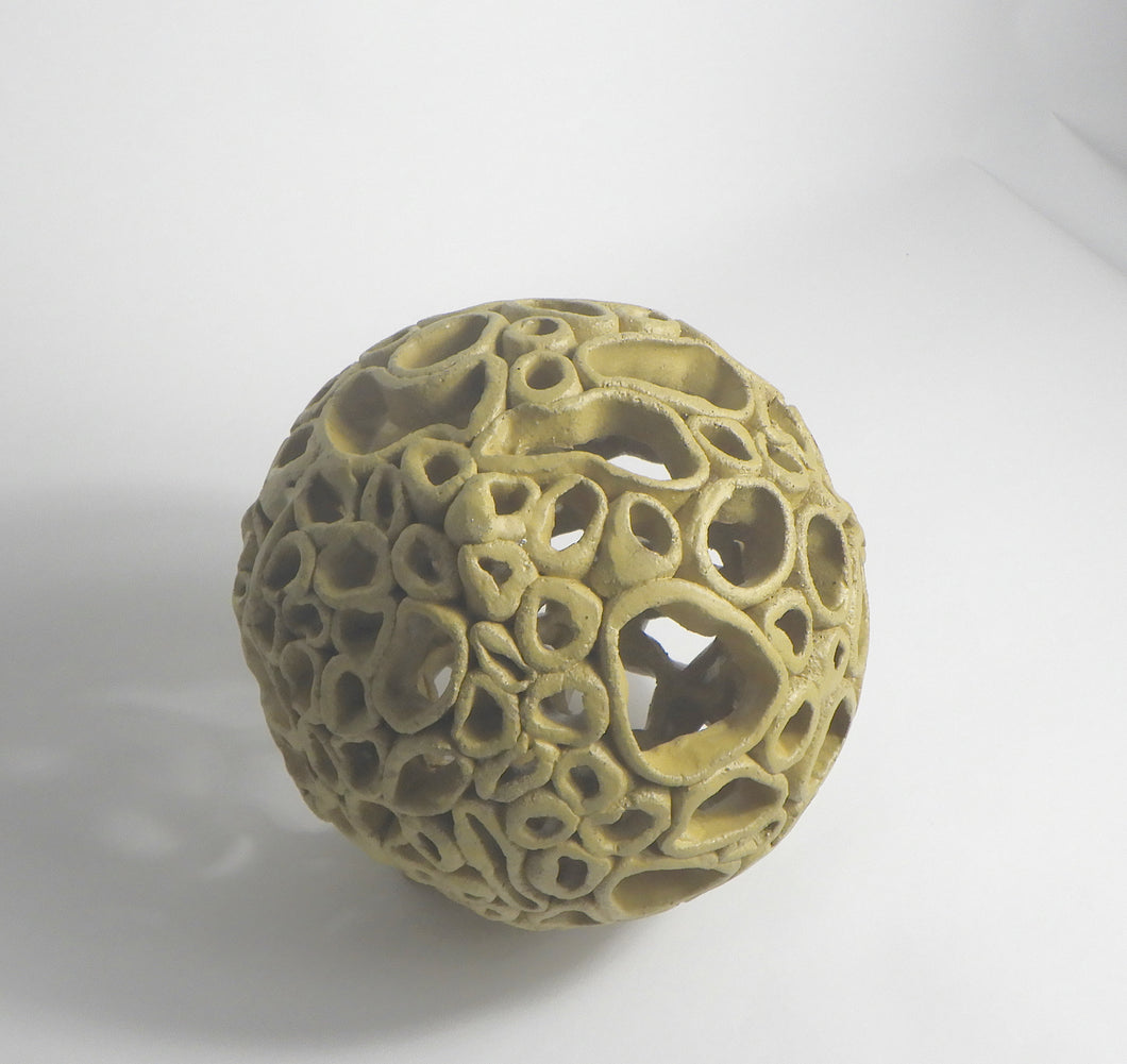 Sphere 1 - Yellow - Like the shoreline, this piece is both strong and vulnerable - shaped endlessly by tide and time.